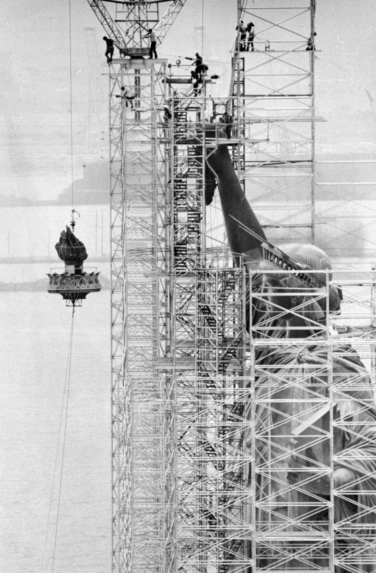 Workers assembling the Statue of Liberty in New York Harbor
